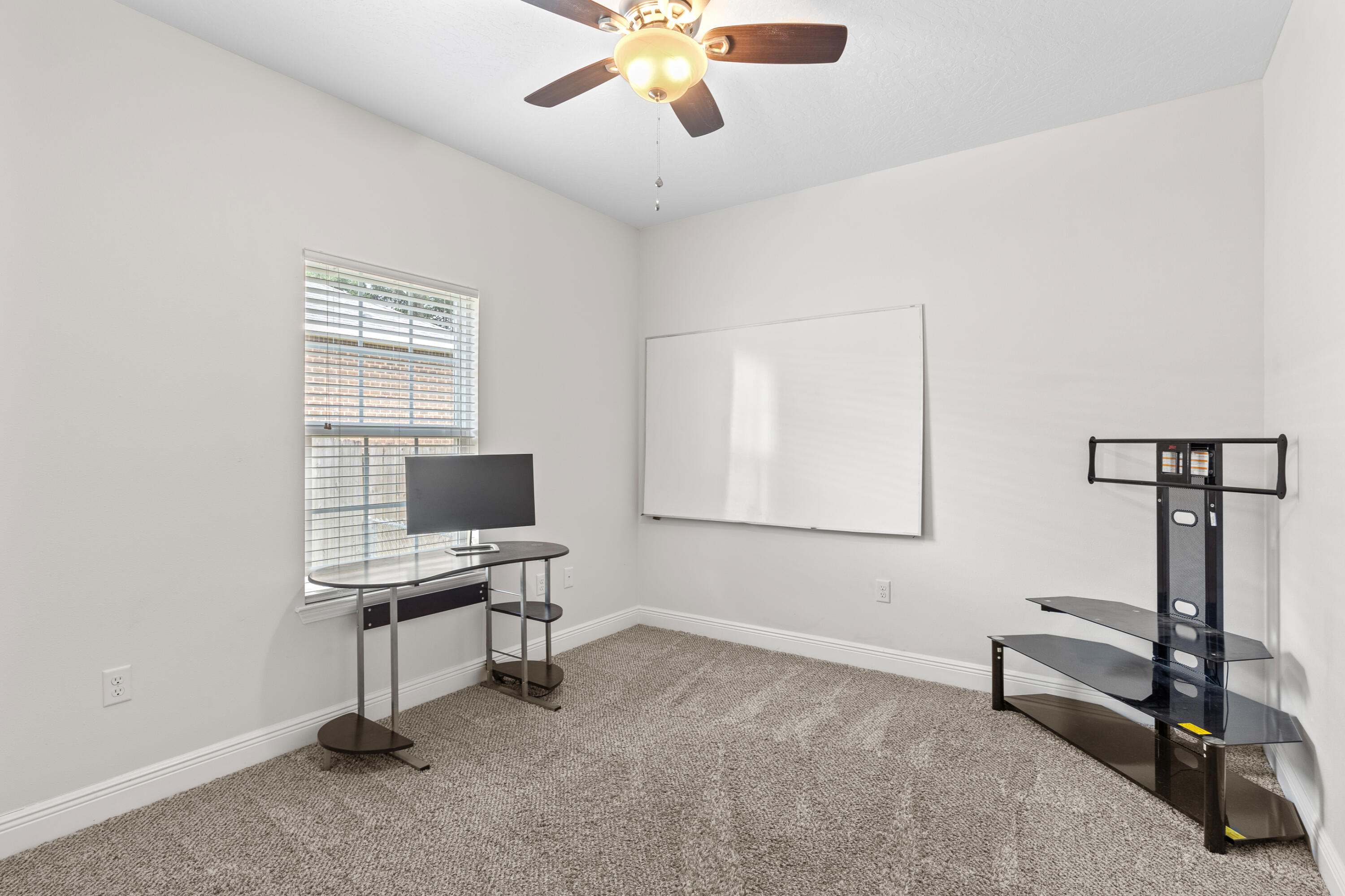 2920 Patch Avenue Crestview, FL 32539 - Photo 30 of 45 a view of a workspace with furniture and a window