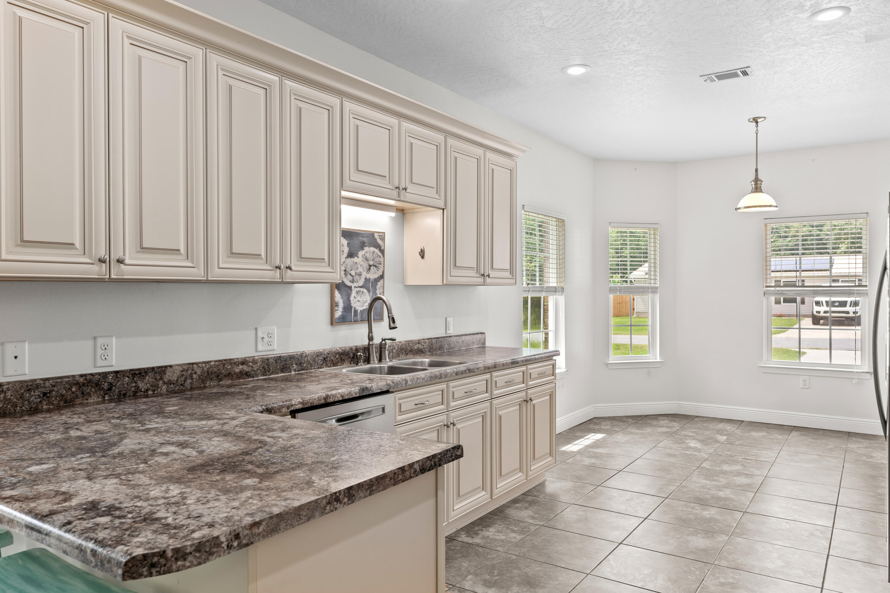 2920 Patch Avenue Crestview, FL 32539 - Photo 4 of 45 a kitchen with a sink window and cabinets