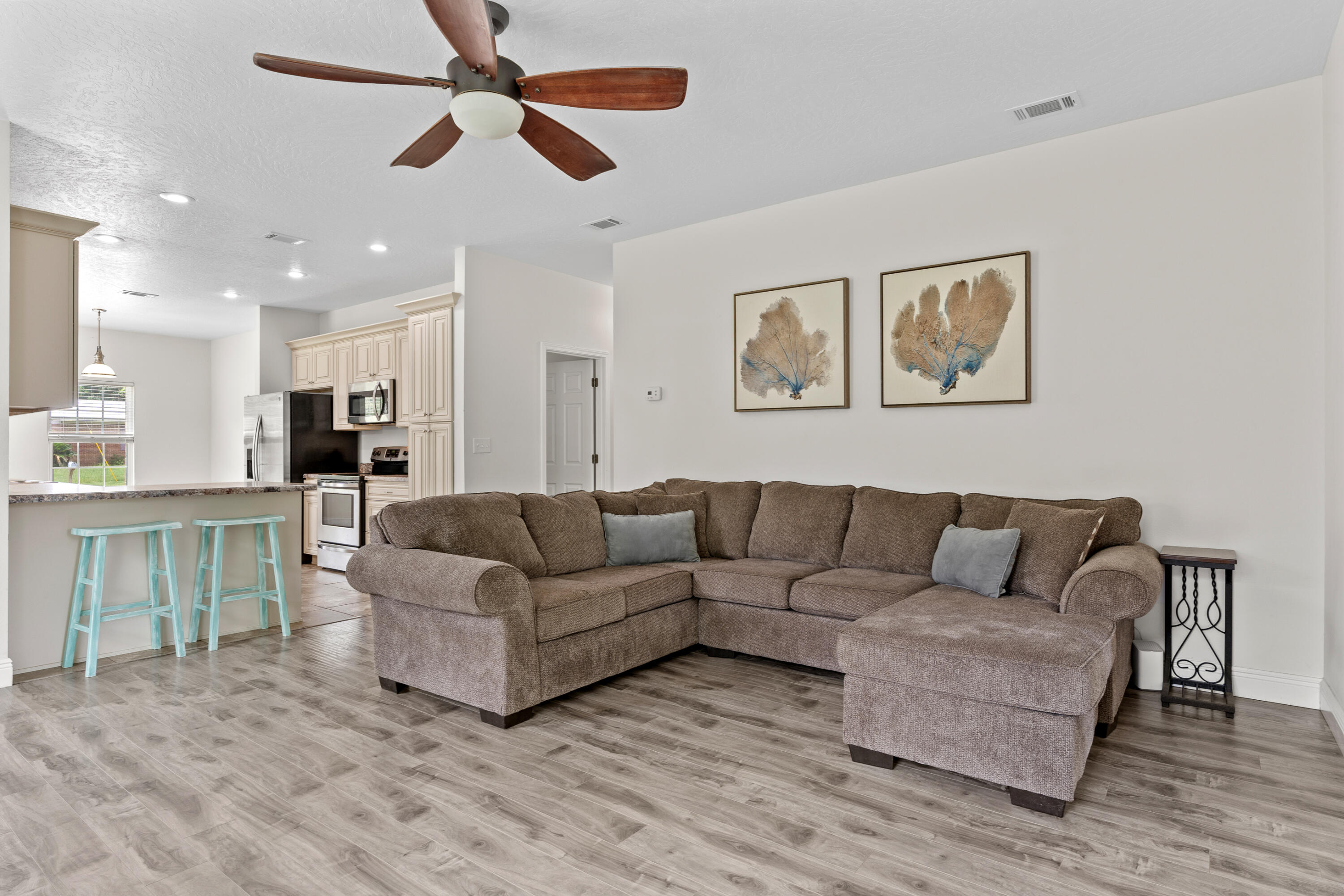 2920 Patch Avenue Crestview, FL 32539 - Photo 6 of 45 a living room with furniture and a wooden floor