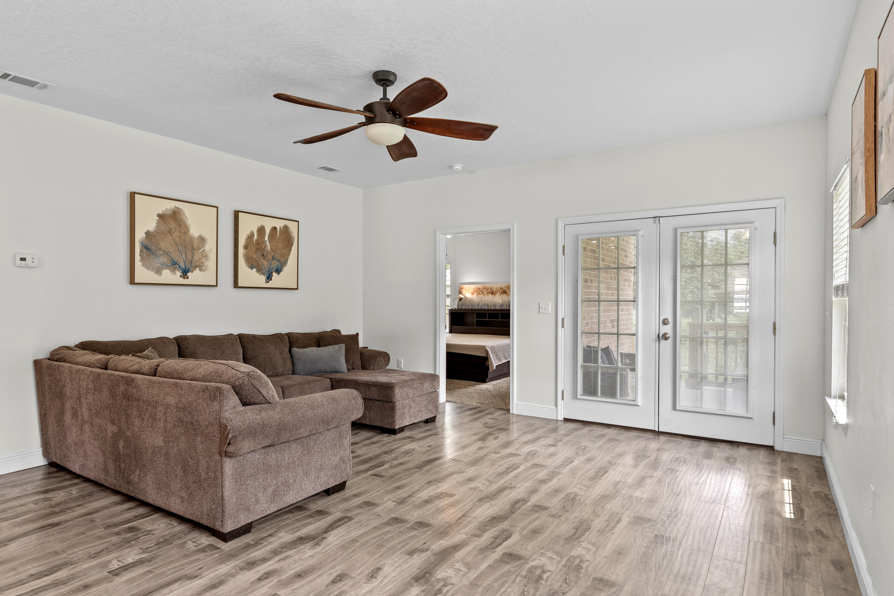 2920 Patch Avenue Crestview, FL 32539 - Photo 7 of 45 a living room with furniture and a large window