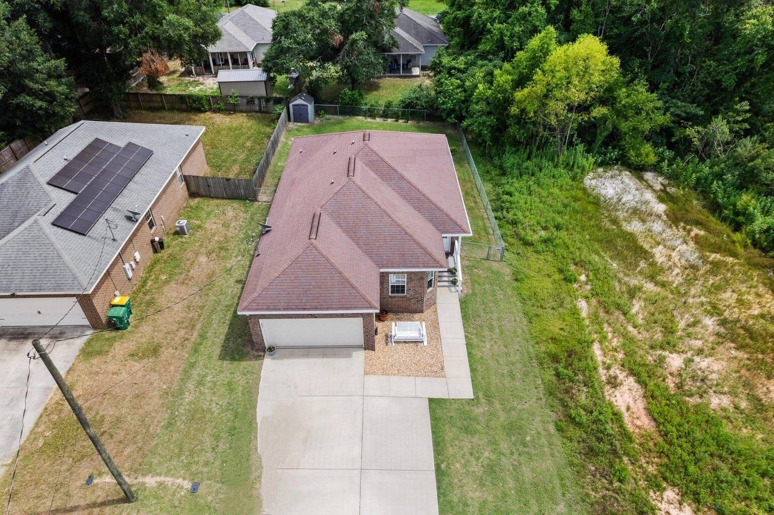 2920 Patch Avenue Crestview, FL 32539 - Photo 9 of 45 an aerial view of a house with swimming pool and garden
