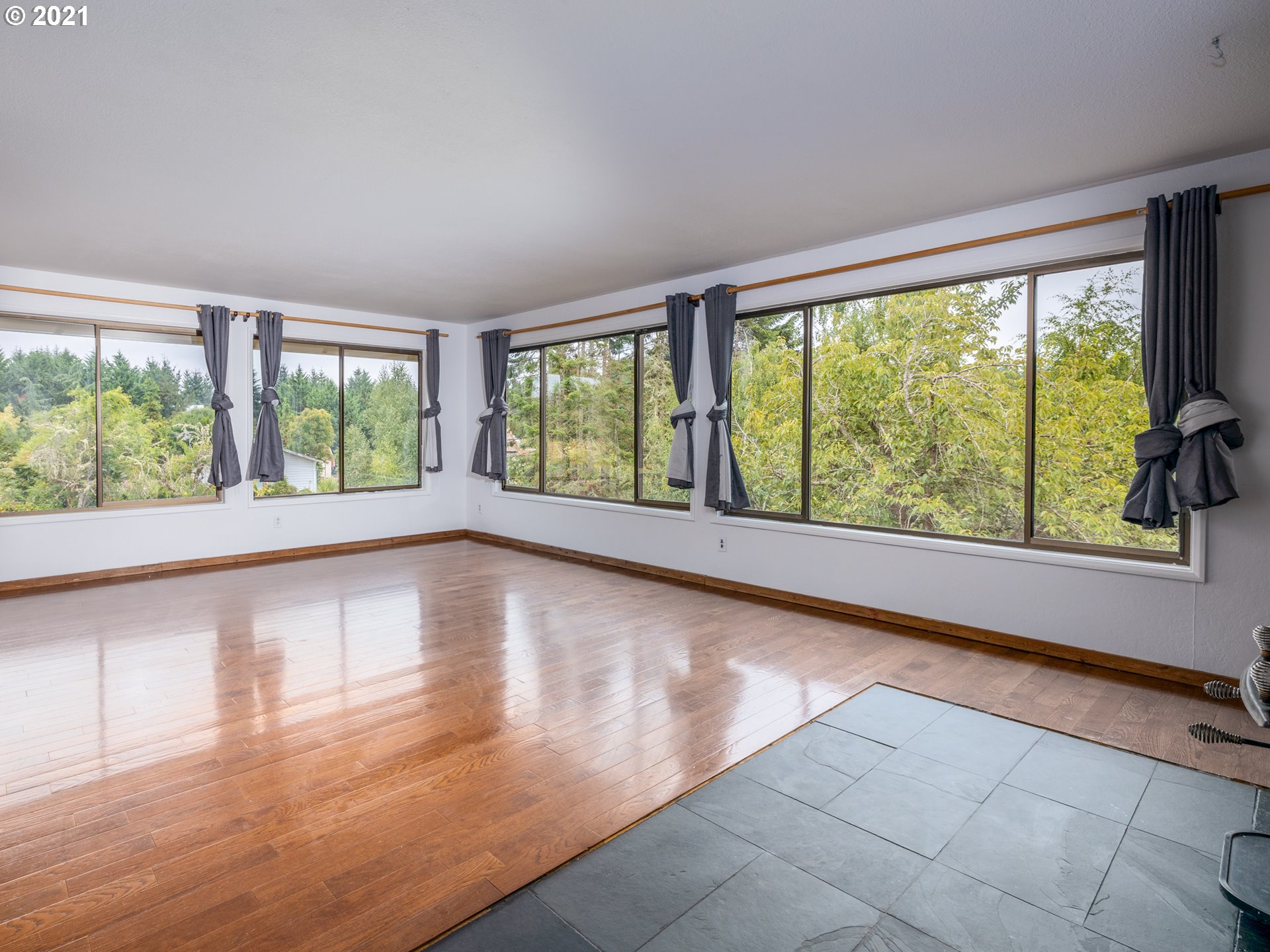 314 Yates Road Chehalis, WA 98532 - Photo 9 of 30 a view of an empty room with wooden floor and a window