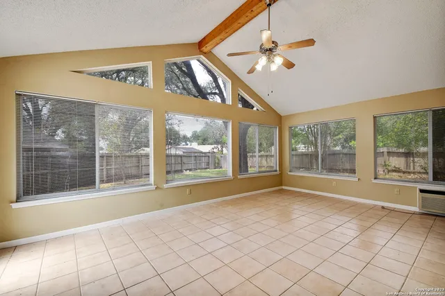 a view of an empty room with a window