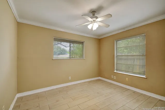 a view of an empty room with a window