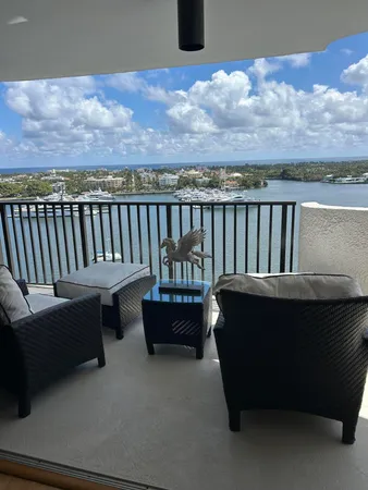 a roof deck with a couches and city view