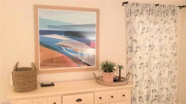 a bathroom with a potted plant and a shower curtain