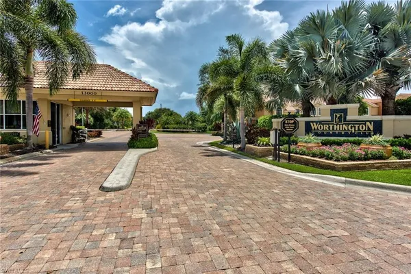 a view of a house with a garden and pathway