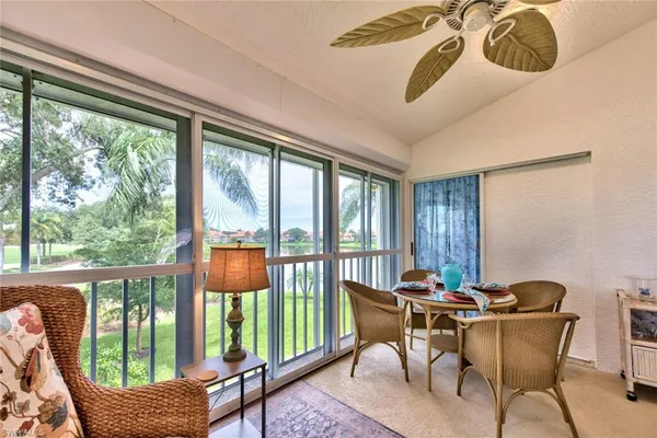 a view of a dining room with furniture window and outside view