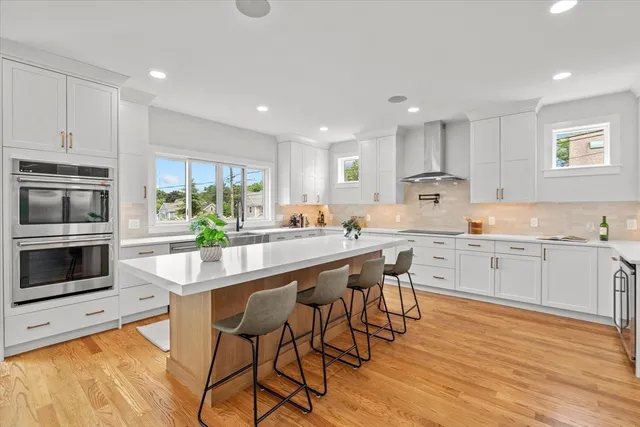a kitchen with a sink and large window