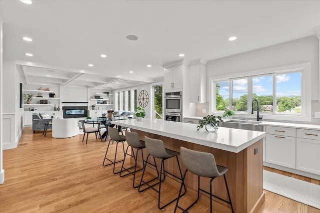 a white bath tub sitting next to a bathroom sink