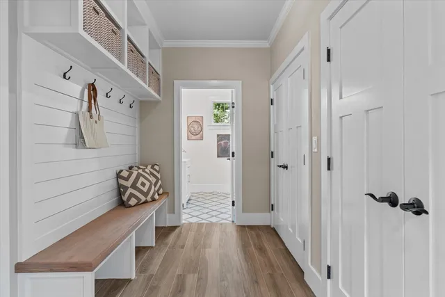 a bathroom with a granite countertop double vanity sink and a mirror