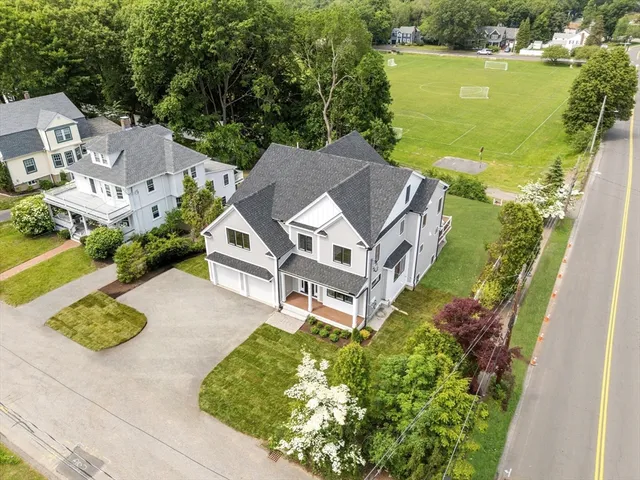 an aerial view of a house with a ocean view