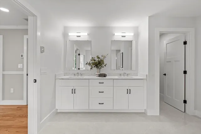 an aerial view of a houses with a yard