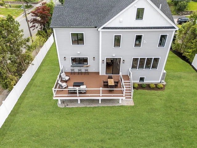 a kitchen with stainless steel appliances granite countertop a sink and a refrigerator