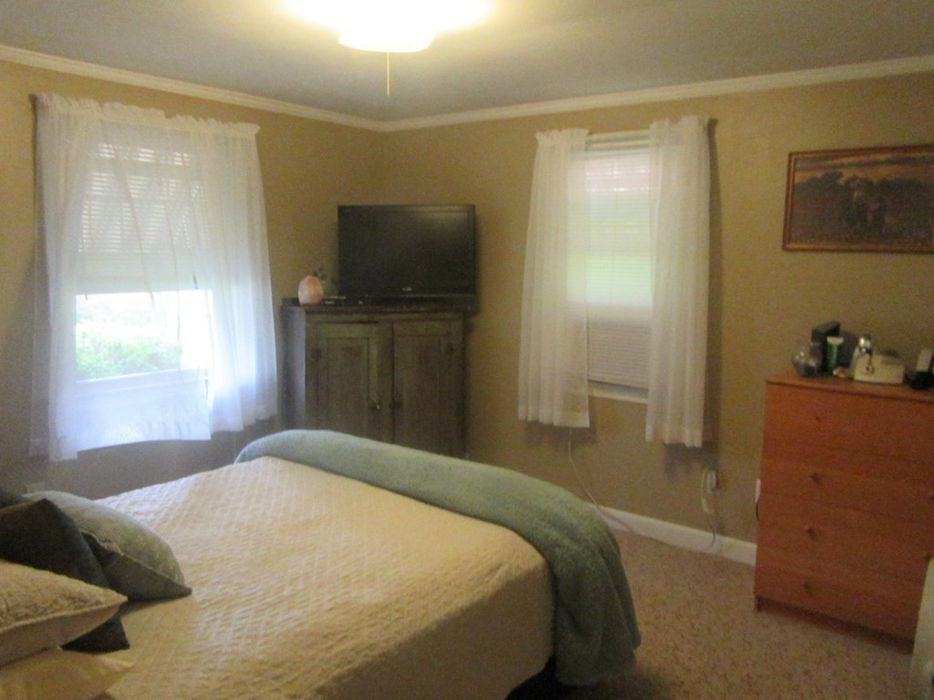92 Maebeth Street Springfield, MA 01119 - Photo 11 of 21 a bedroom with a bed and a television in it