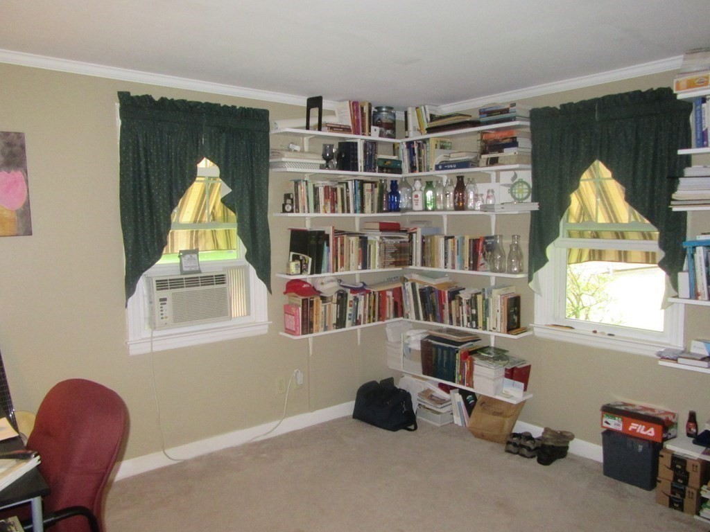 92 Maebeth Street Springfield, MA 01119 - Photo 12 of 21 a workspace with a bookshelf and a window