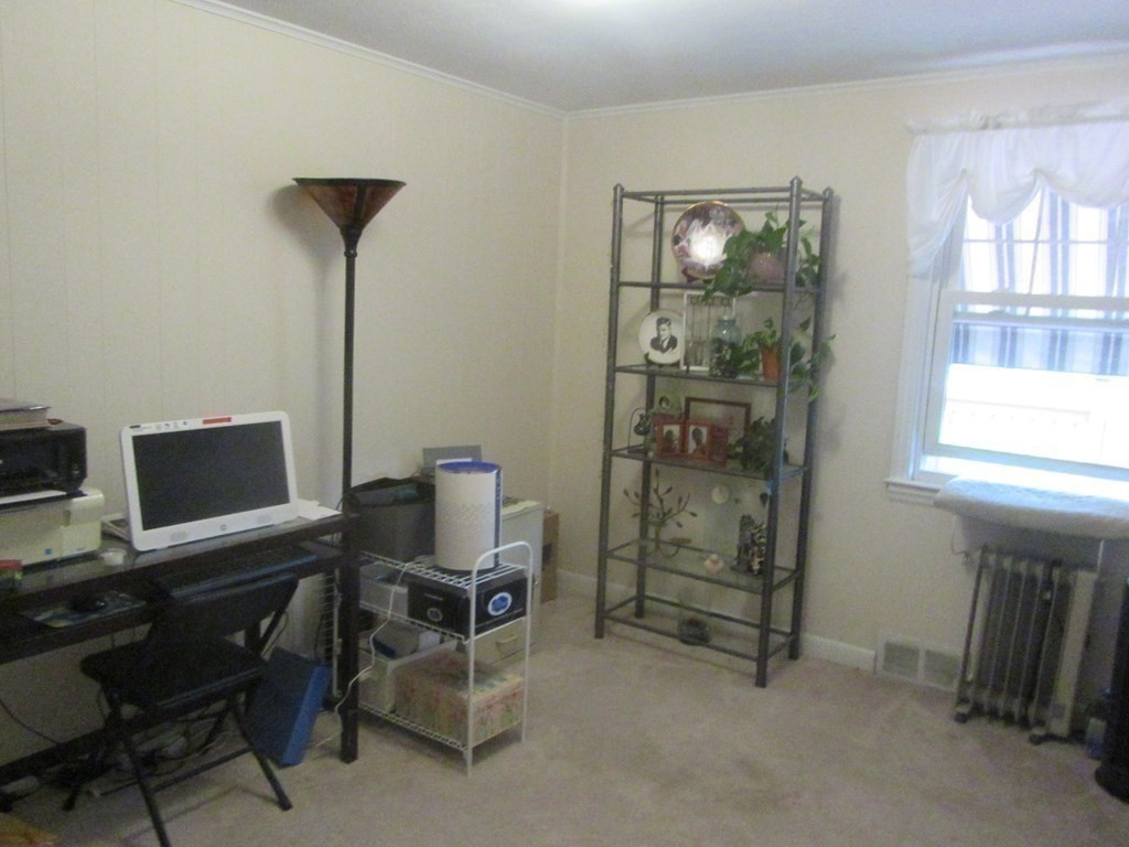 92 Maebeth Street Springfield, MA 01119 - Photo 13 of 21 a view of a workspace with furniture and a window
