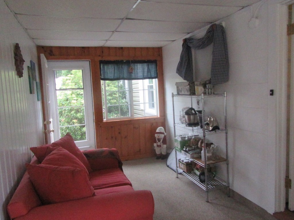 92 Maebeth Street Springfield, MA 01119 - Photo 15 of 21 a living room with furniture and a flat screen tv