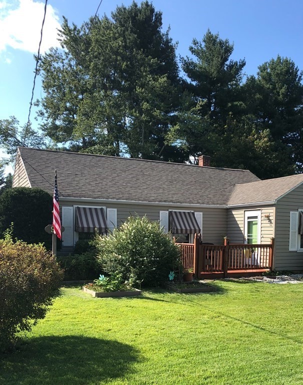 92 Maebeth Street Springfield, MA 01119 - Photo 3 of 21 a backyard of a house with yard and outdoor seating