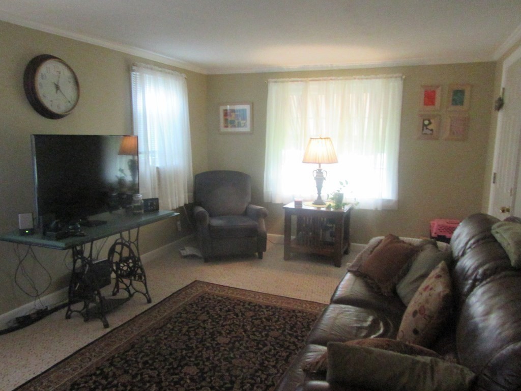 92 Maebeth Street Springfield, MA 01119 - Photo 10 of 21 a living room with furniture and a flat screen tv