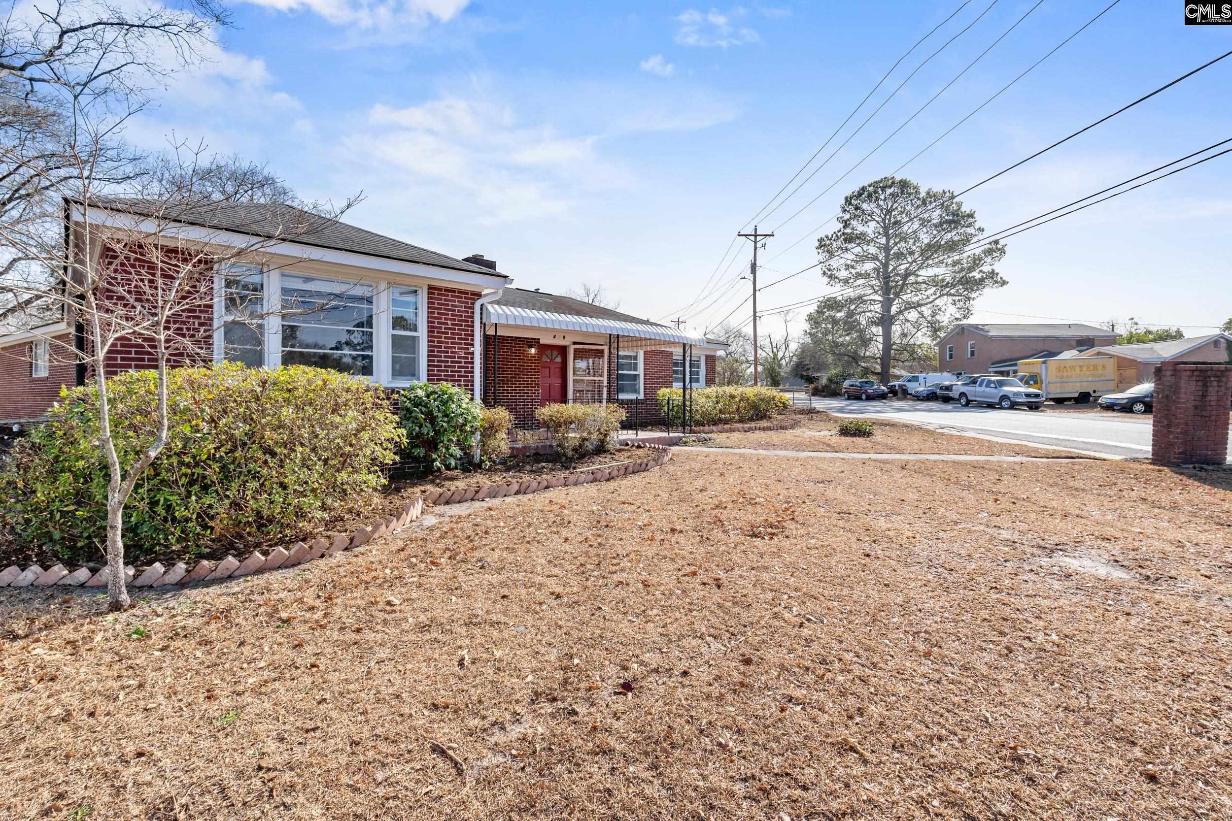 409 Wilkes Road Columbia, SC 29203 - Photo 2 of 34 a row of houses with a street