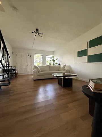 a kitchen with sink and cabinets