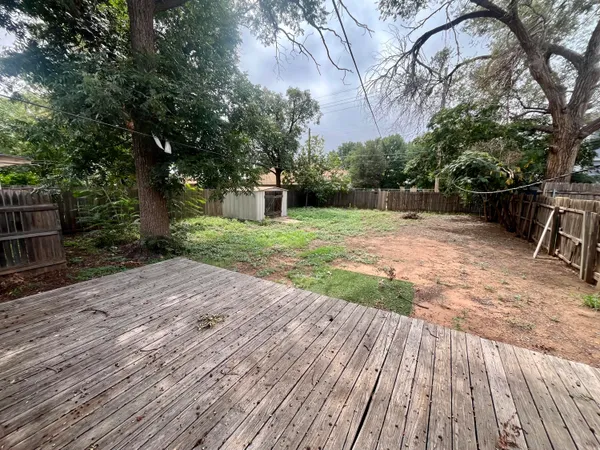 a view of backyard with green space