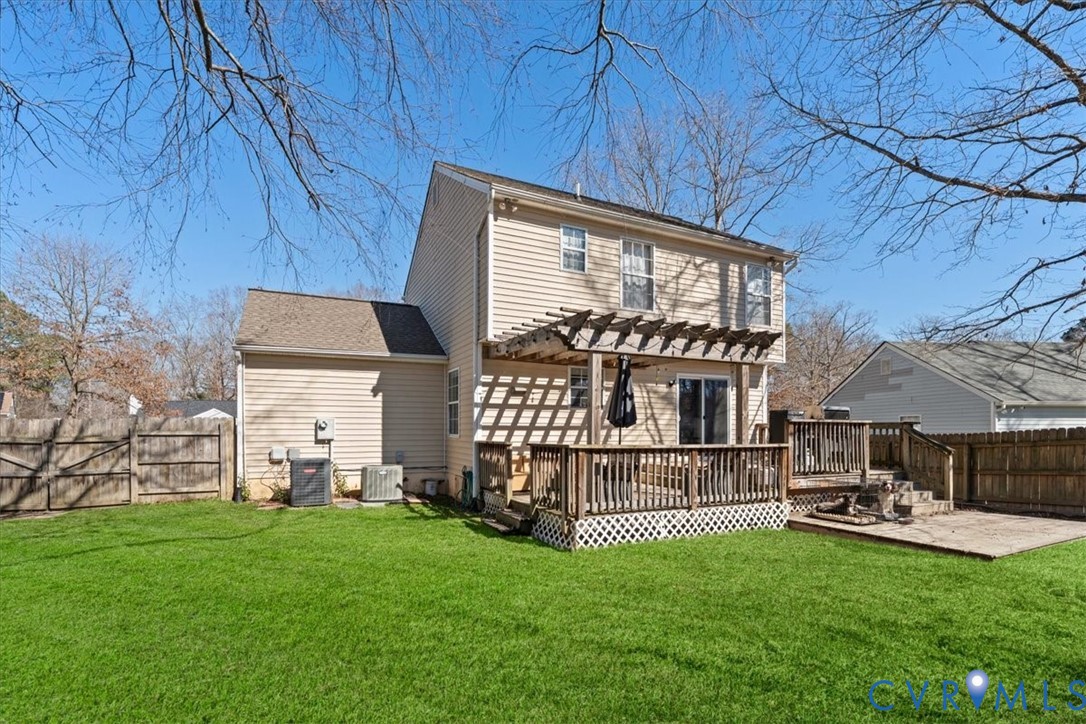 14126 Bermuda Point Court Chester, VA 23836 - Photo 11 of 50 a view of backyard with a garden and deck