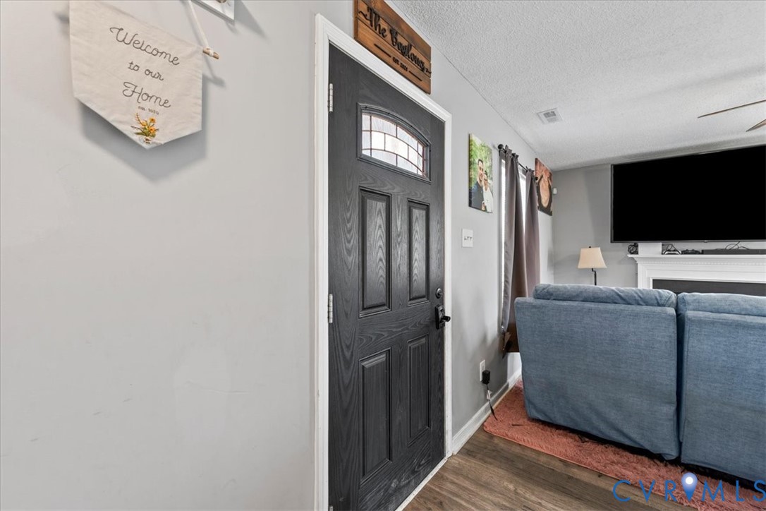 14126 Bermuda Point Court Chester, VA 23836 - Photo 26 of 50 a living room with furniture and a flat screen tv