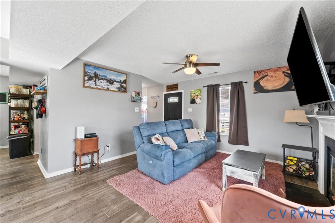 14126 Bermuda Point Court Chester, VA 23836 - Photo 29 of 50 a living room with furniture and a flat screen tv