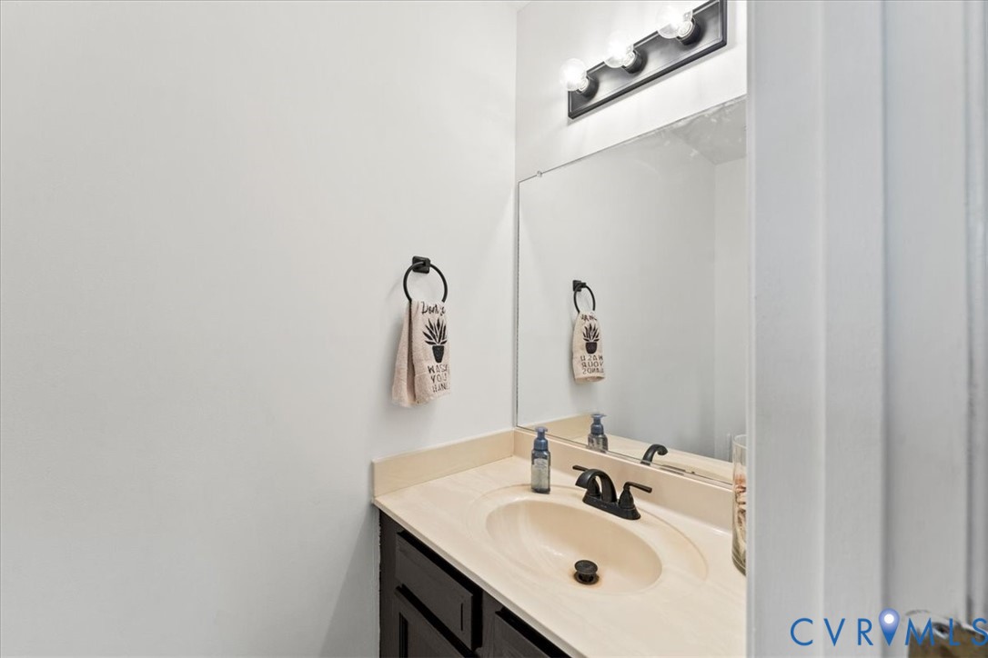 14126 Bermuda Point Court Chester, VA 23836 - Photo 37 of 50 a bathroom with a sink and a mirror