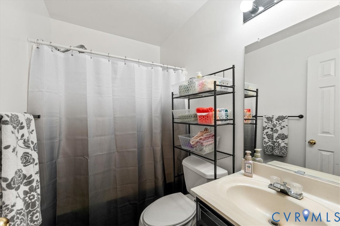 14126 Bermuda Point Court Chester, VA 23836 - Photo 39 of 50 a bathroom with a sink toilet and shower