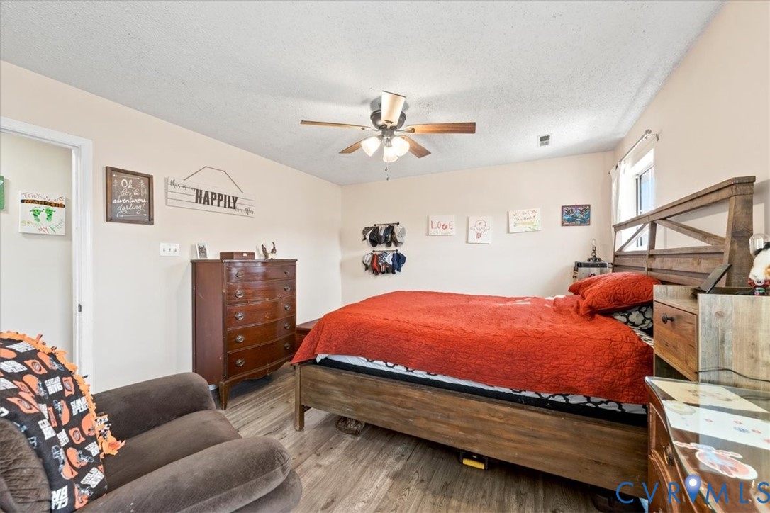 14126 Bermuda Point Court Chester, VA 23836 - Photo 43 of 50 a bed room with a bed and furniture