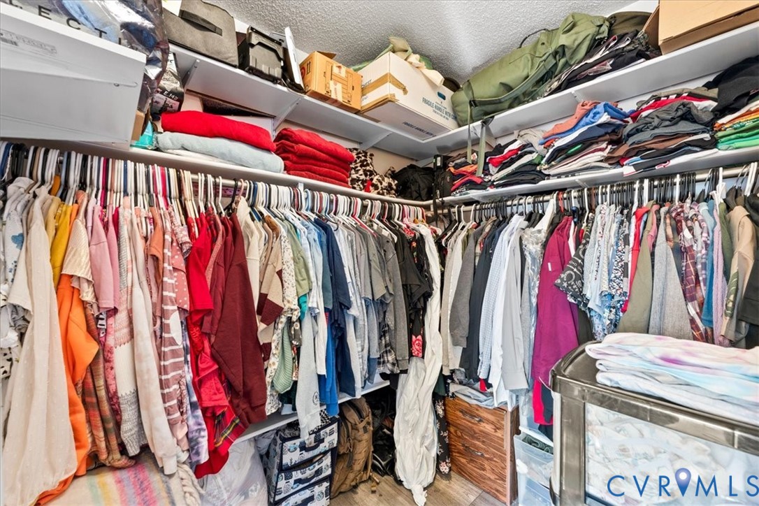 14126 Bermuda Point Court Chester, VA 23836 - Photo 45 of 50 a view of walk in closet with clothes