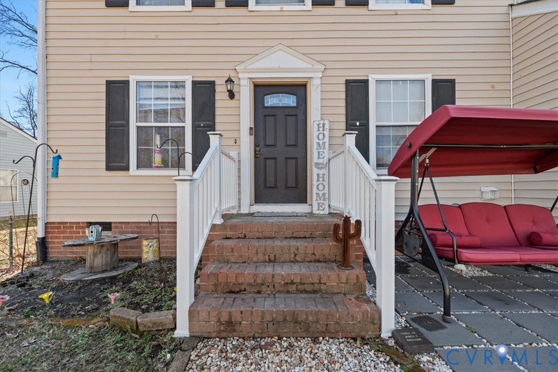 14126 Bermuda Point Court Chester, VA 23836 - Photo 5 of 50 a view of a house with a bench and wooden door