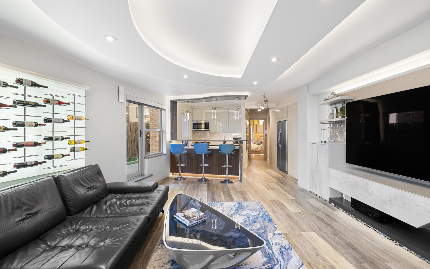 210 East 47th Street, Unit 11F Manhattan, NY 10017 - Photo 5 of 9 a living room with furniture and a flat screen tv