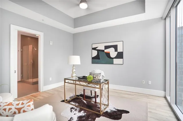 a living room with furniture a rug and a window