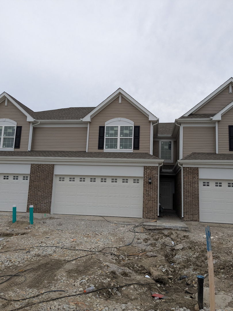 7828 Nightshade Lane Joliet, IL 60431 - Photo 1 of 23 a front view of a house with a yard