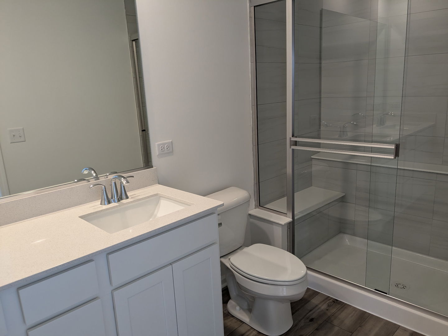 7828 Nightshade Lane Joliet, IL 60431 - Photo 12 of 23 a bathroom with a sink a toilet and shower