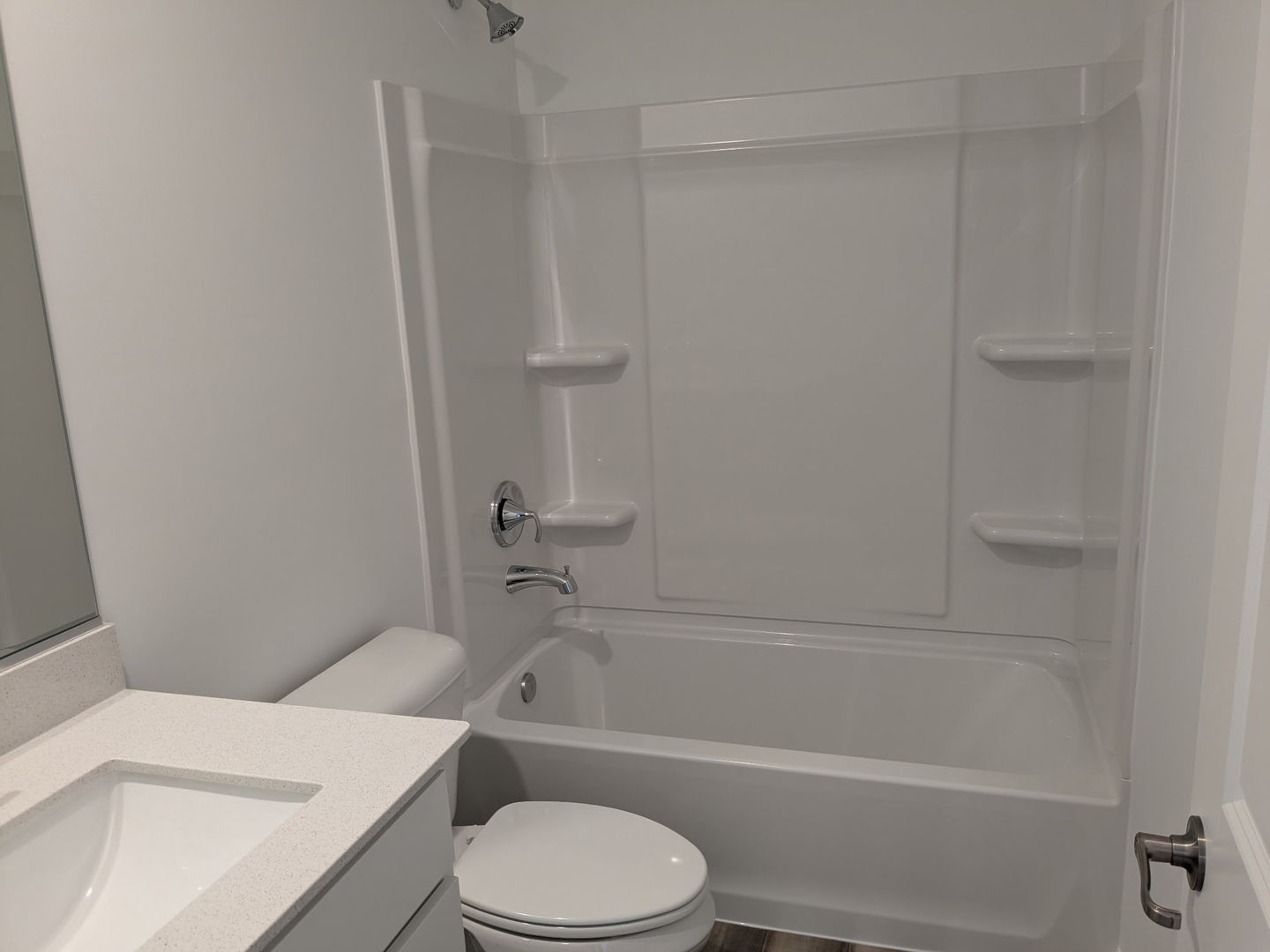 7828 Nightshade Lane Joliet, IL 60431 - Photo 9 of 23 a bathroom with a toilet and a bath tub