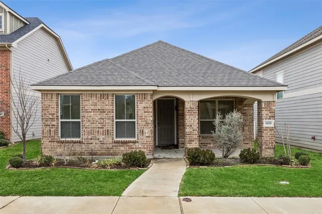front view of a house and a yard