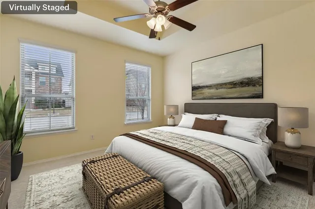 a bedroom with a bed and a window