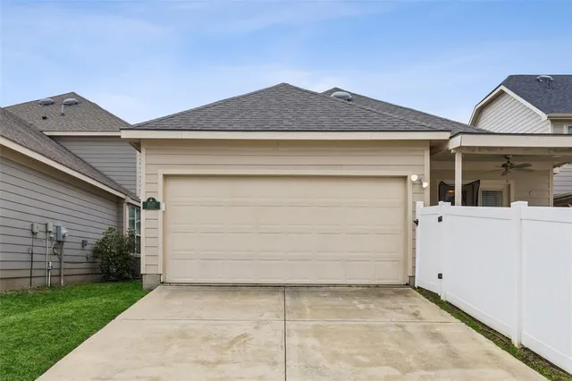 an aerial view of a house with outdoor seating ocean view