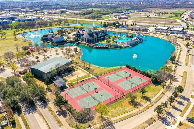 an aerial view of a houses with outdoor space