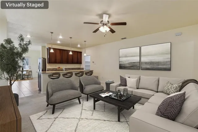 a living room with furniture and a large window