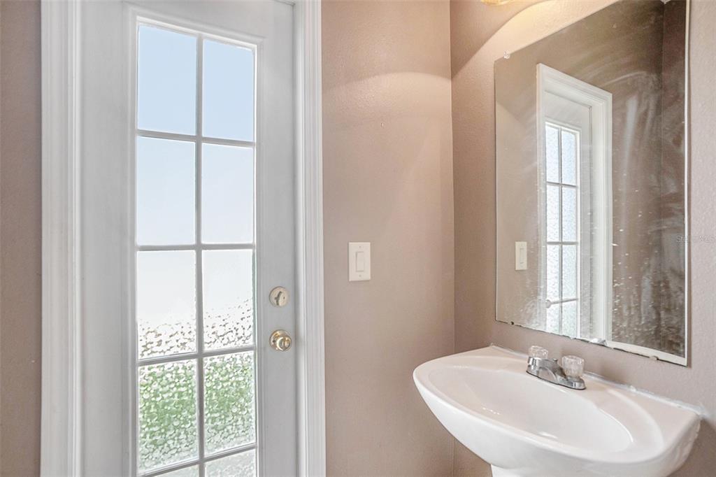 7641 Armonk Lane Wesley Chapel, FL 33545 - Photo 14 of 34 a bathroom with a sink and a mirror