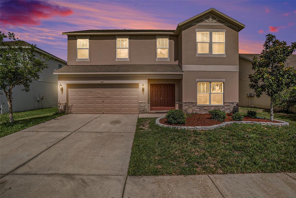 7641 Armonk Lane Wesley Chapel, FL 33545 - Photo 2 of 34 a front view of a house