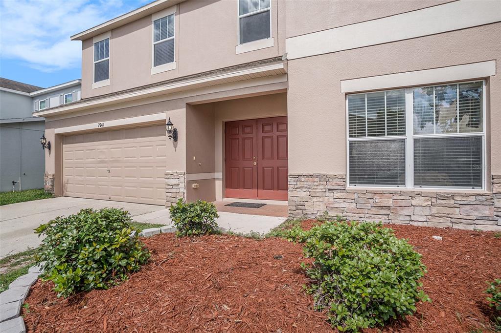 7641 Armonk Lane Wesley Chapel, FL 33545 - Photo 3 of 34 front view of a house