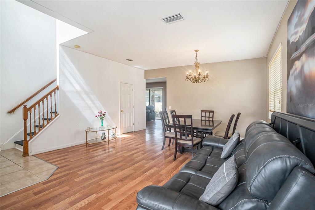 7641 Armonk Lane Wesley Chapel, FL 33545 - Photo 5 of 34 a living room with furniture and wooden floor