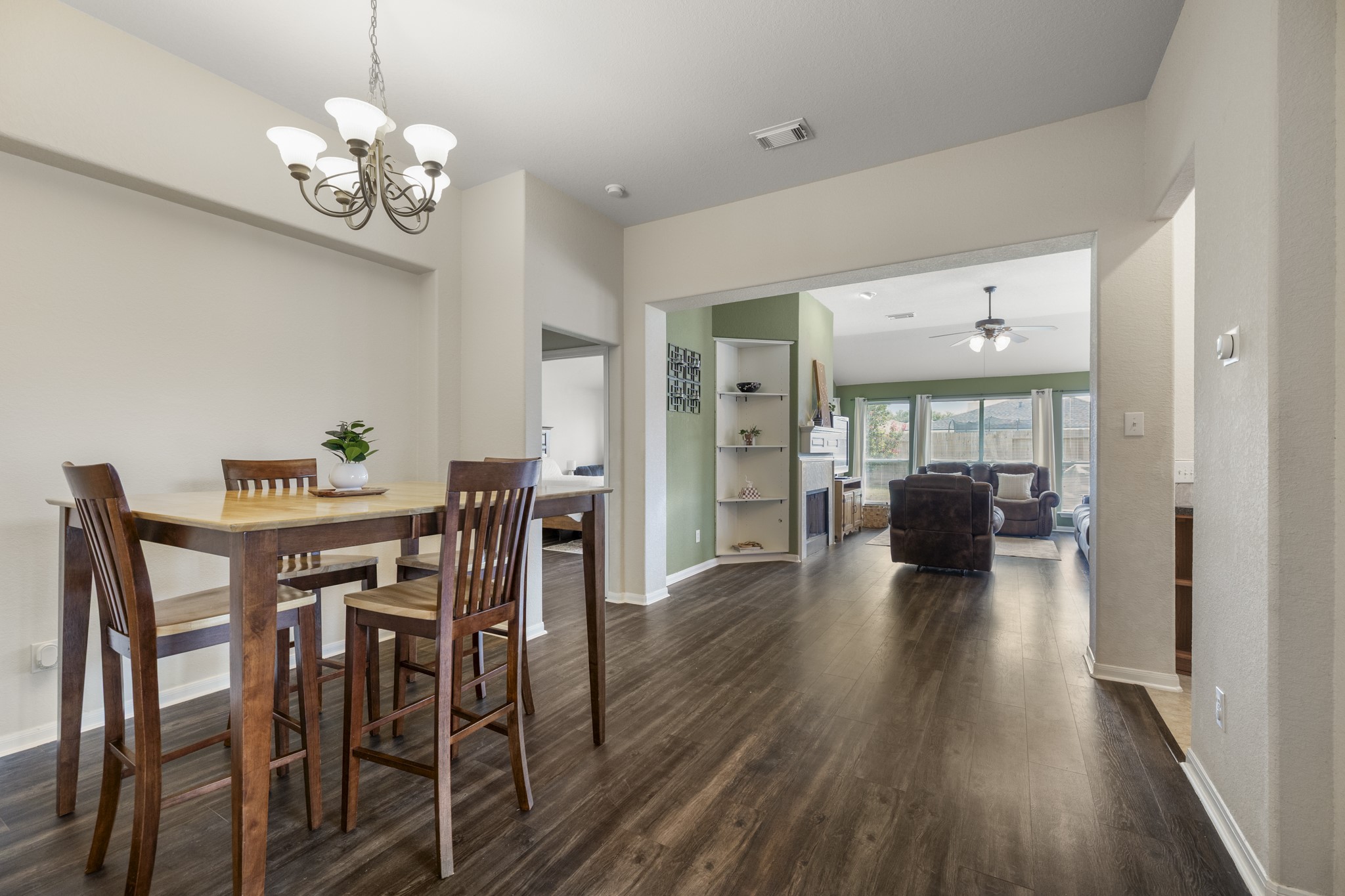 3422 Falcon Trail Court Spring, TX 77373 - Photo 8 of 35 a view of a dining room and livingroom with furniture wooden floor a chandelier